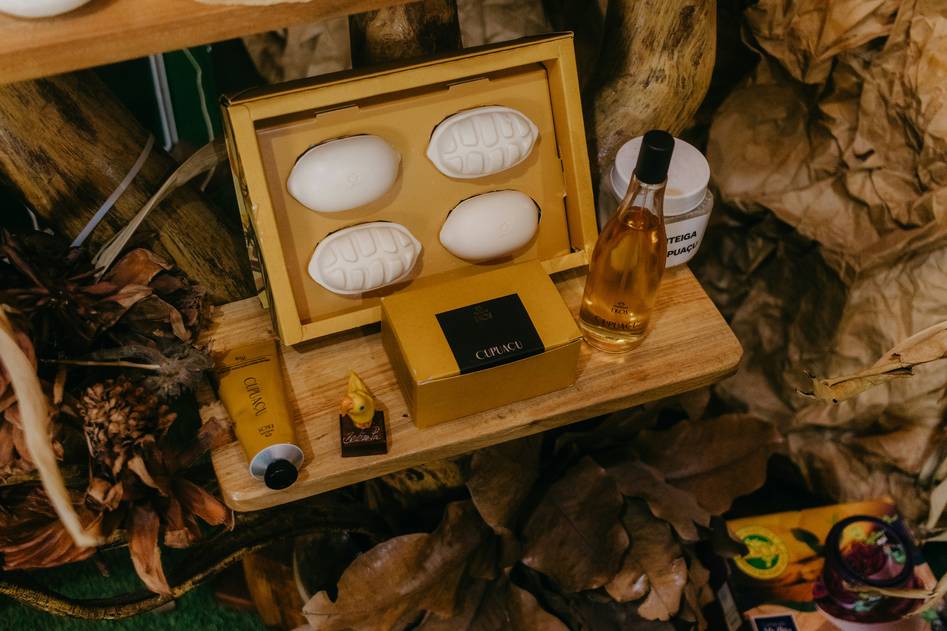 Organic moisturizer jar with fresh botanicals on natural linen